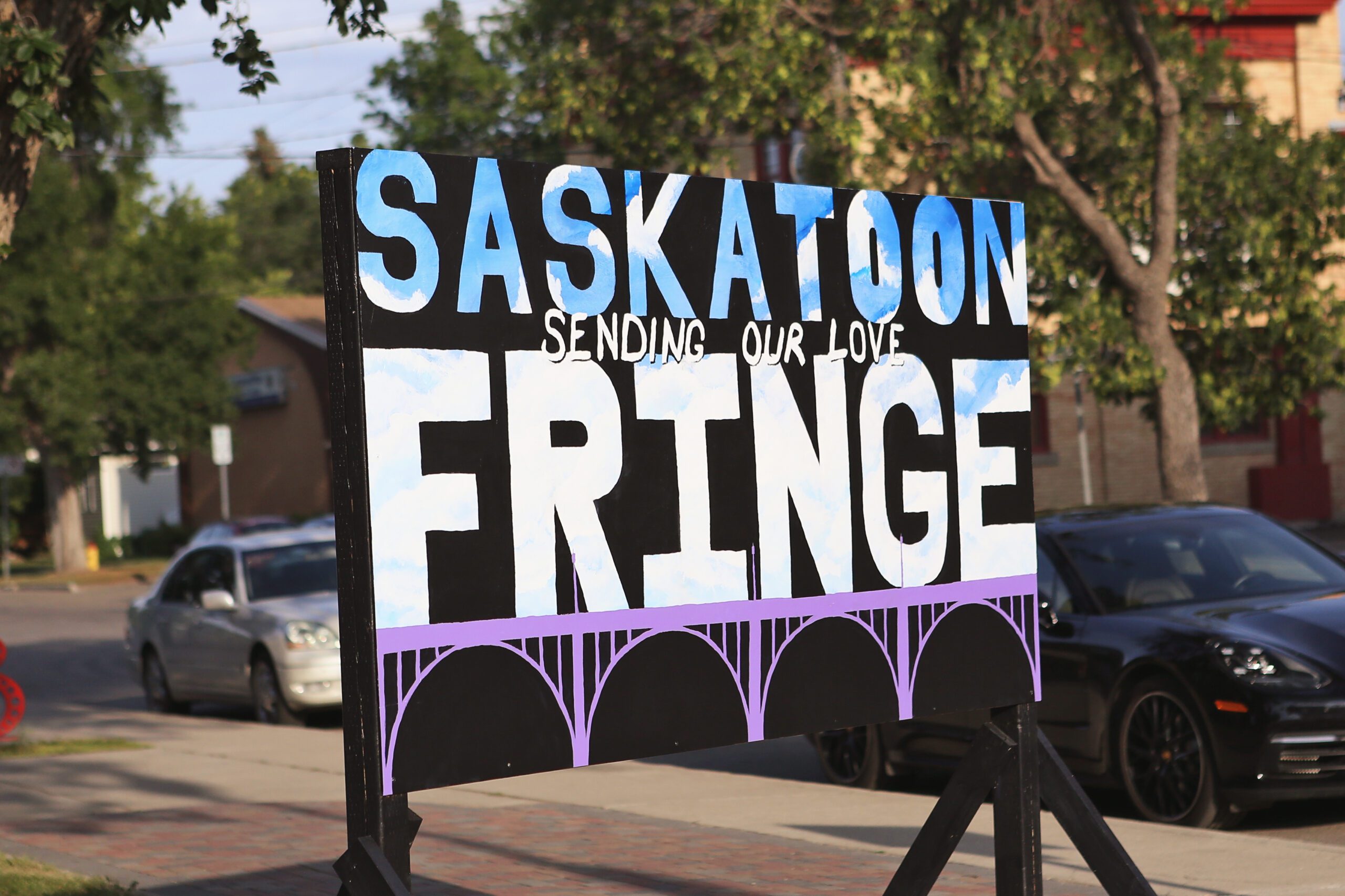 Sign with Saskatoon Sending our love Fringe, photo credit Nicole Stevenson Sign with Saskatoon Sending our love Fringe, photo credit Nicole Stevenson